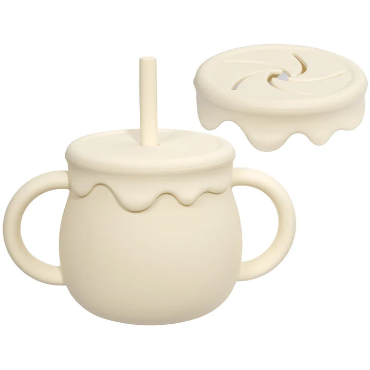 Non-spill portable silicone food cup for baby and toddler snacks, featuring an easy handle.