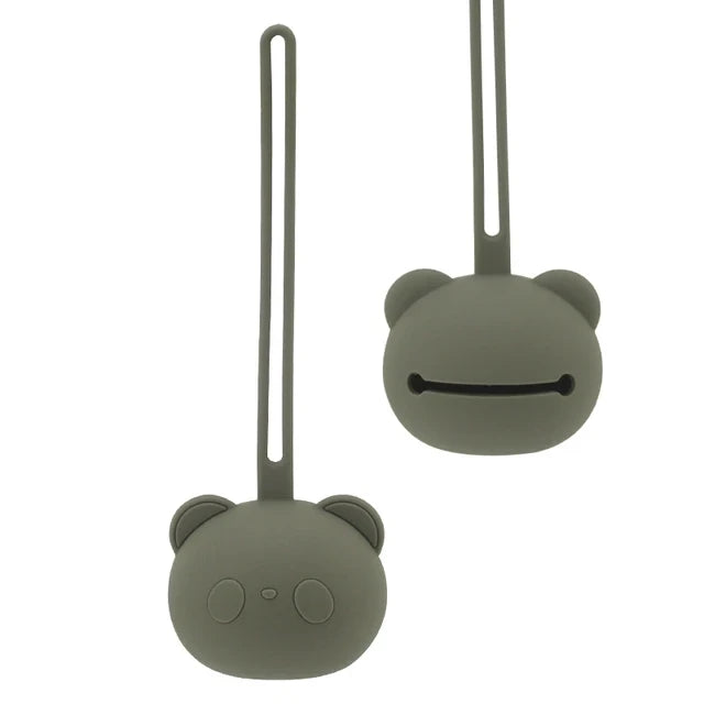 Yellow silicone pacifier holder, a practical baby travel accessory for keeping soothers clean