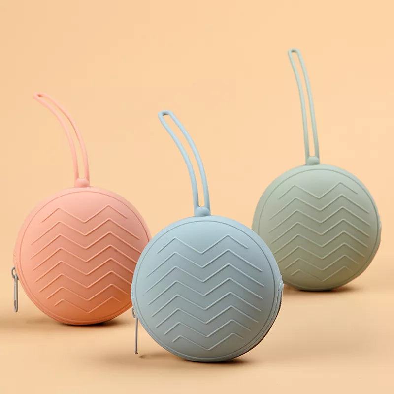 A stack of colorful silicone pacifier boxes, portable soother containers for baby hygiene