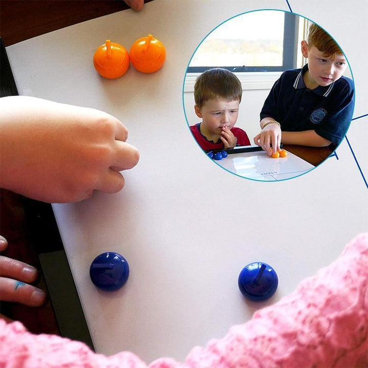 Kids joyfully playing the Portable Tabletop Curling Game, a fun indoor board game for developing skills.