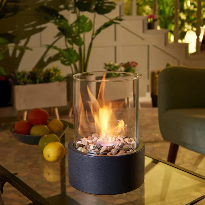 Portable tabletop fire lantern, perfect for outdoor ambiance on patios, decks, or gardens. Modern design.