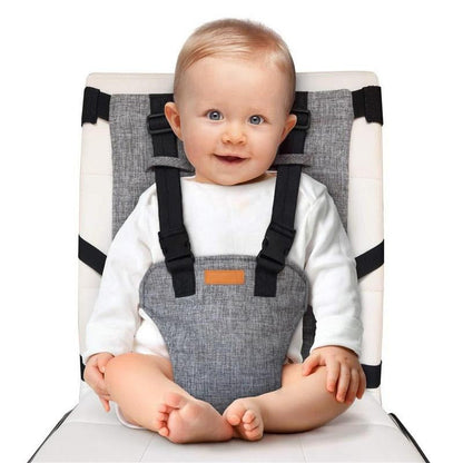 Portable travel high chair for infants & toddlers in a dining setting, highlighting its on-the-go convenience