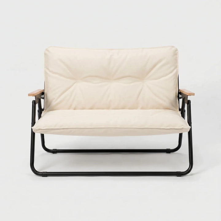 Compact folding camping sofa, easily portable for travel, offering durable outdoor seating for two.