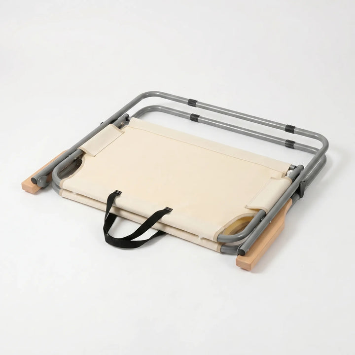 Durable portable two-person folding sofa providing comfortable outdoor seating for camping trips.