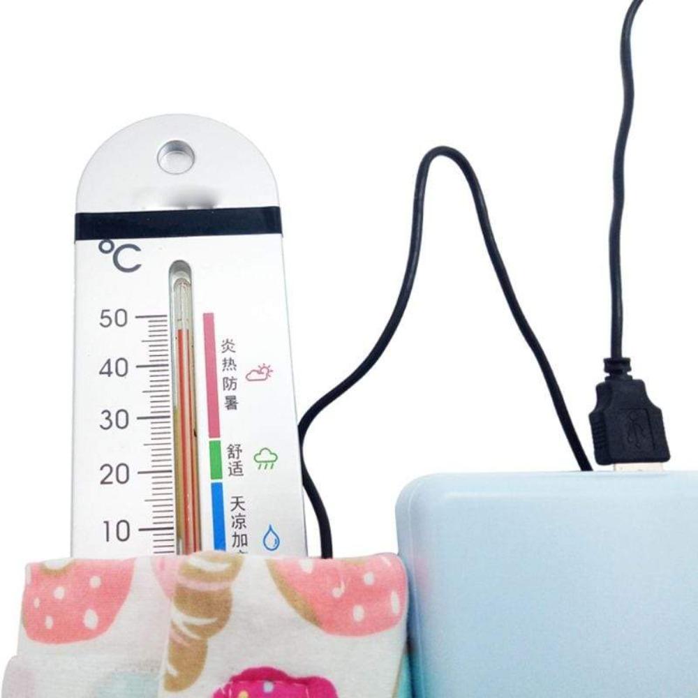 Compact USB bottle warmer heating baby's milk, essential travel baby gear for parents