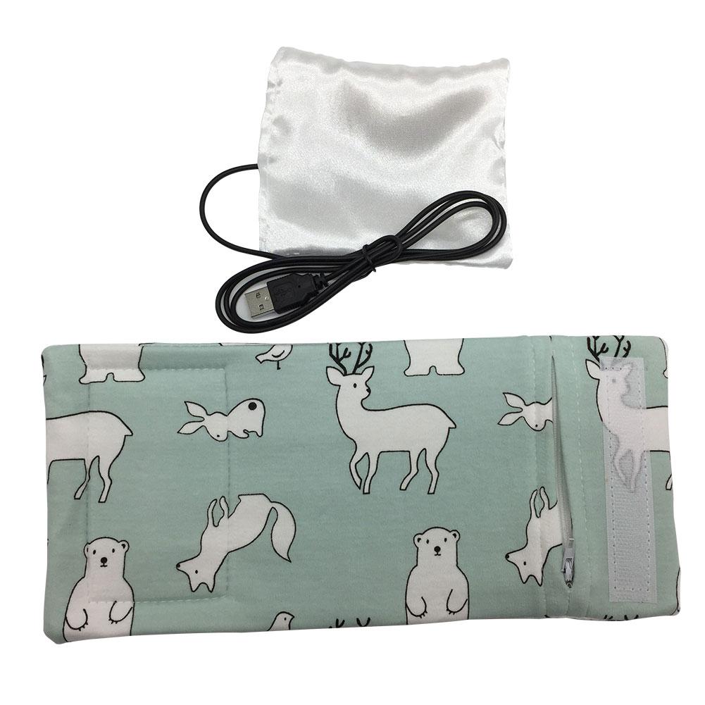 Portable USB milk warmer securely holding a baby bottle, great for travel and outings