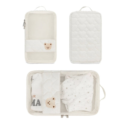 Mom carrying white bear portable diaper bag, a waterproof travel organizer for infant care