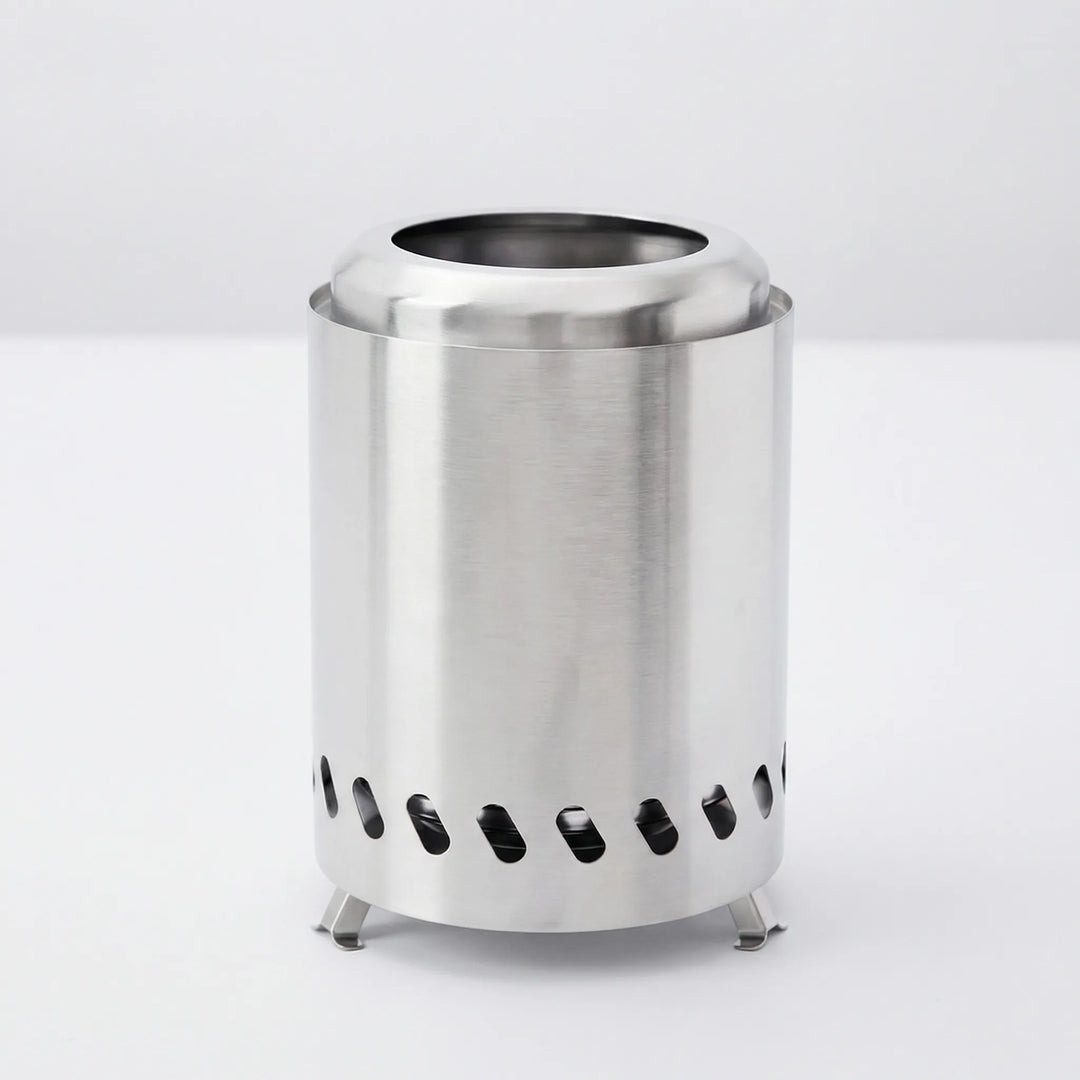 Compact stainless steel wood stove, perfect for camp kitchen and survival gear in the wilderness.