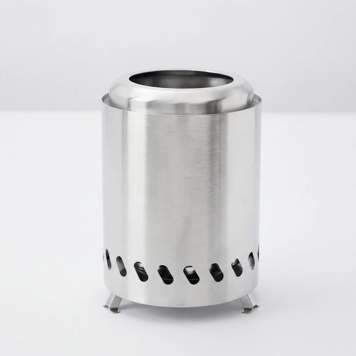 Compact stainless steel wood stove, perfect for camp kitchen and survival gear in the wilderness.