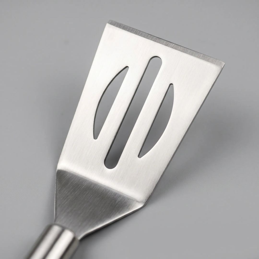 Ergonomic stainless steel BBQ tools including spatula, tongs, & fork. Ideal for grilling & backyard BBQs.