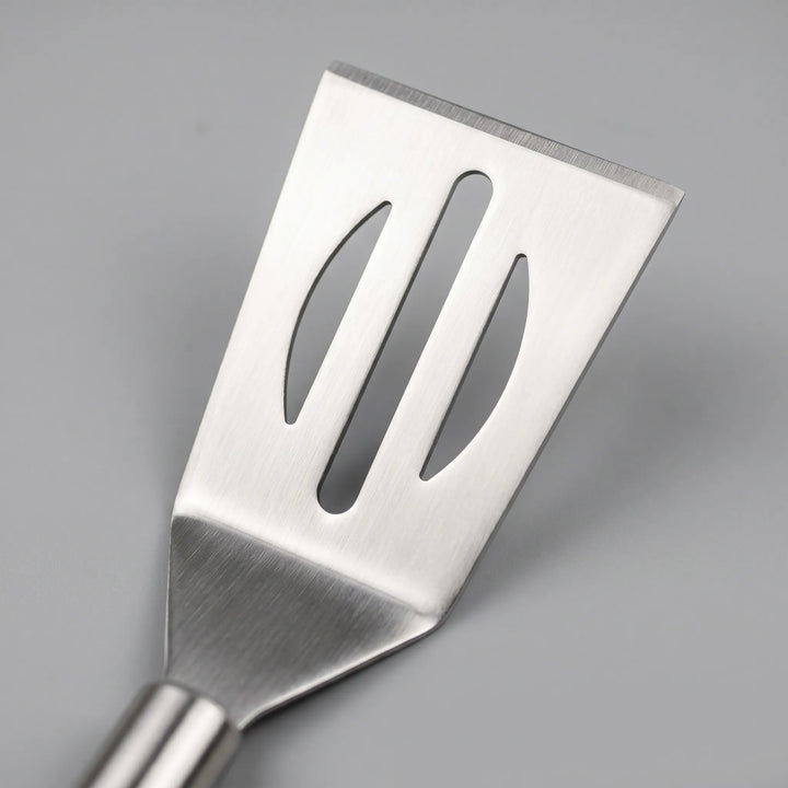 Ergonomic stainless steel BBQ tools including spatula, tongs, & fork. Ideal for grilling & backyard BBQs.