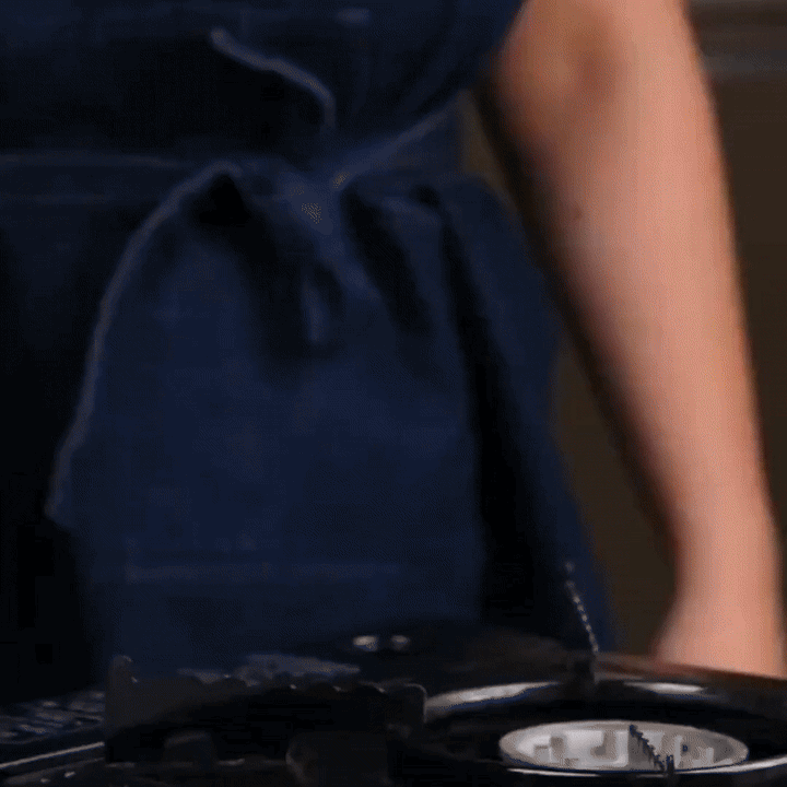 Versatile premium uncoated stainless steel pan, suitable for all cooktops in a modern kitchen.