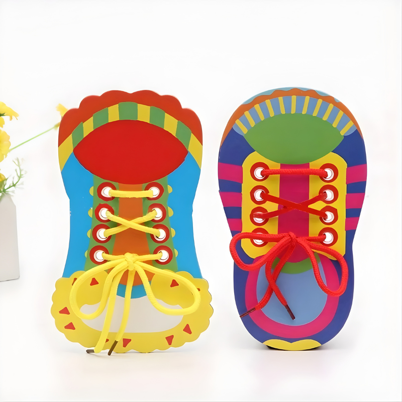 Preschooler practices shoe tying with a colorful Kids Shoelace Tying Trainer Toy, developing fine motor skills.
