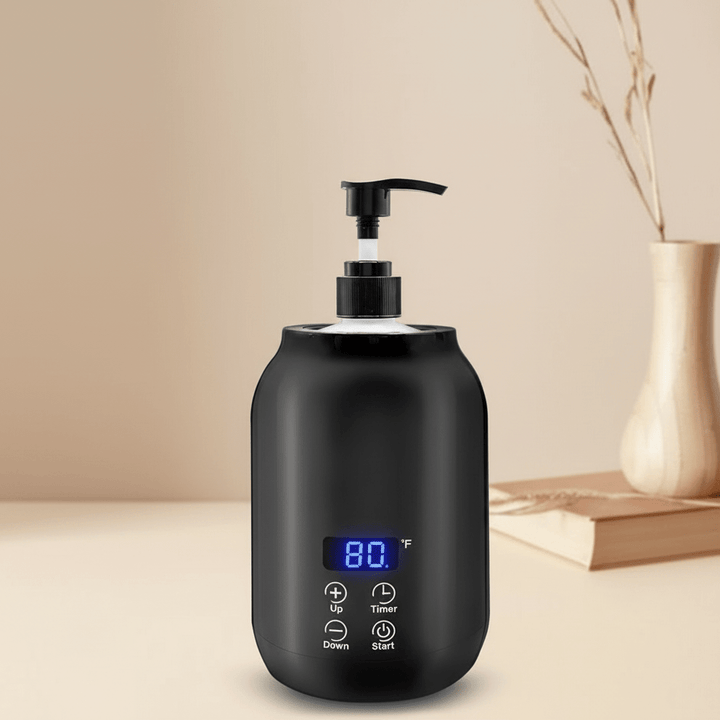 Close-up of professional electric oil warmer, showing heated massage oil ready for therapy & spa use.
