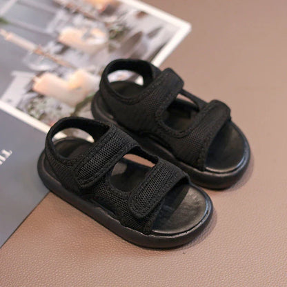 Toddler's purple breathable sandals with adjustable straps, ideal summer footwear for children.