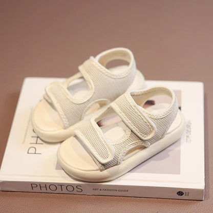 Stylish purple toddler sandals, offering breathable comfort and easy wear for summer outdoor play.