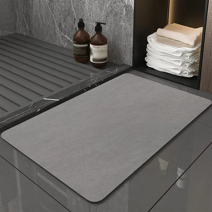 Eco-friendly diatomite bath mat with quick-dry technology and anti-slip surface. Perfect for modern homes.