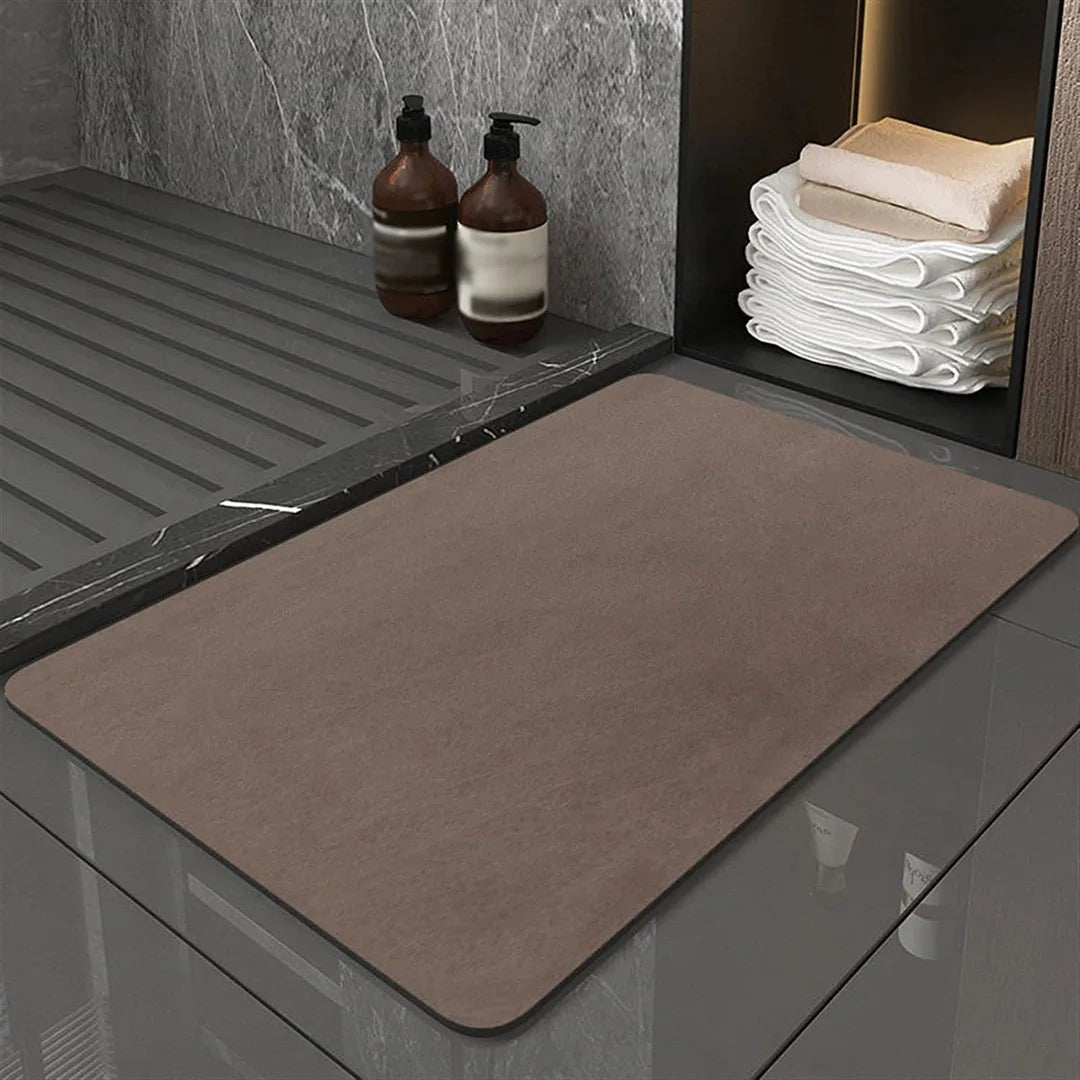 Absorbent diatomite floor mat, quick drying and anti-slip. Ideal for bathroom, kitchen, or entryway.