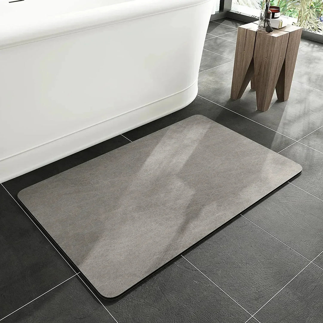 Anti-slip diatomite mat for home. Quick dry and highly absorbent, great for bathroom or kitchen decor.