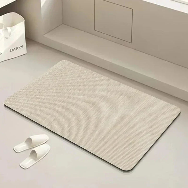 Textured quick dry diatomite bath mat, highly absorbent and anti-slip. Essential modern bathroom floor decor.
