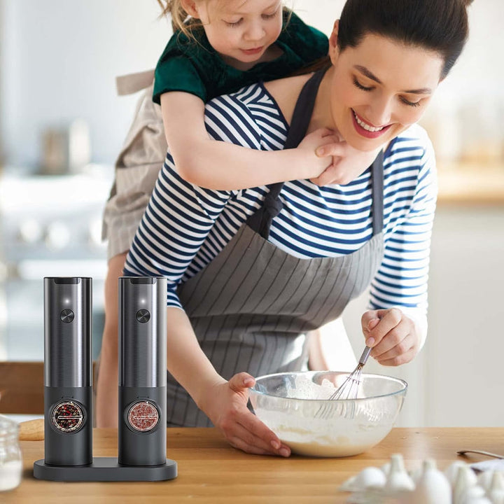 Modern kitchen gadget: rechargeable electric salt & pepper mill set. Stainless steel, ideal for home cooks.
