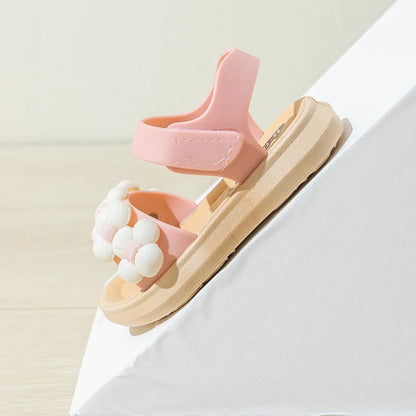 Pair of blue anti-slip summer sandals for kids, breathable and comfortable.