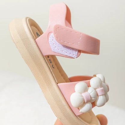 Top view of green anti-slip kids' sport sandals, quick dry for beach fun.