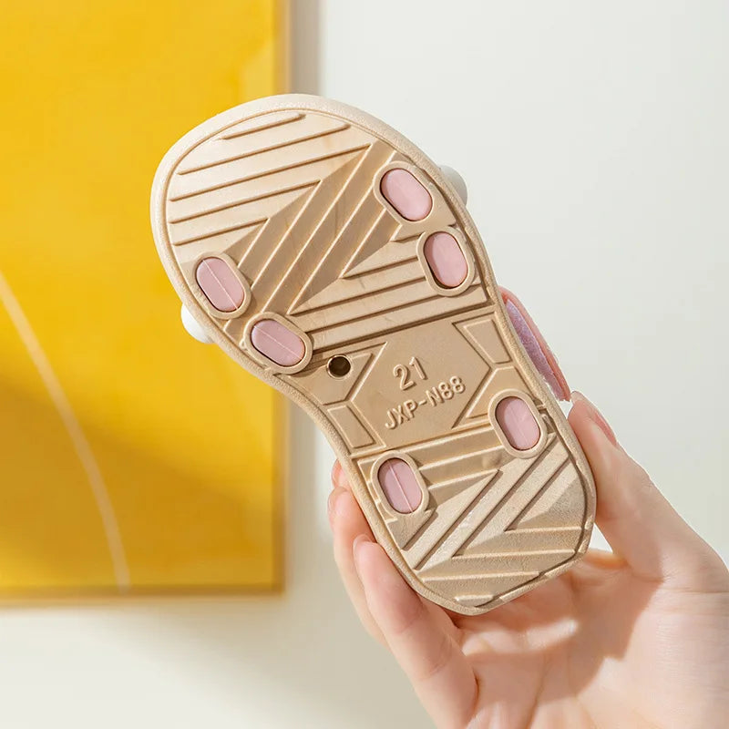 Black anti-slip kids' beach footwear, quick dry for all summer activities.