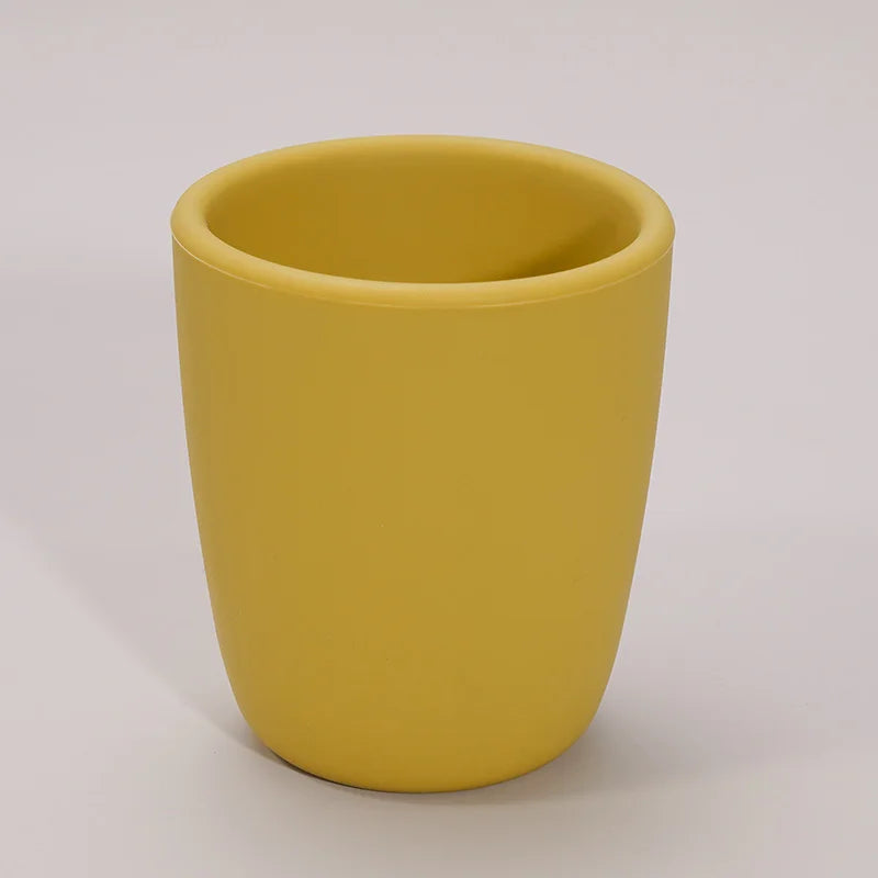 Close-up of baby food-grade silicone snack cup, textured grip, spill proof features