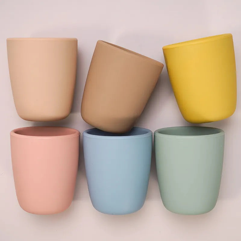 Portable baby snack cup made of food-grade silicone, shown with snacks inside