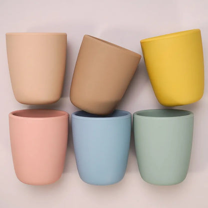 Portable baby snack cup made of food-grade silicone, shown with snacks inside