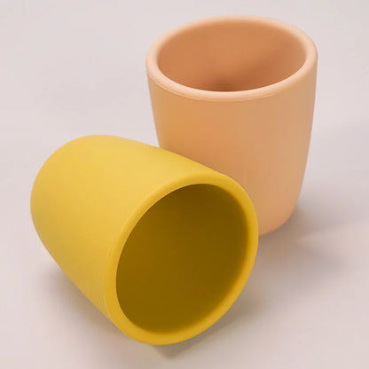 Food-grade silicone snack cup with easy open lid, promoting toddler independence