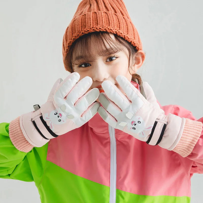 Blue kids' waterproof ski gloves, essential winter accessories for warm snow play.