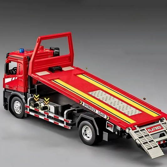 Red die-cast tow truck toy with working lights and realistic sounds, perfect for interactive kids' play.