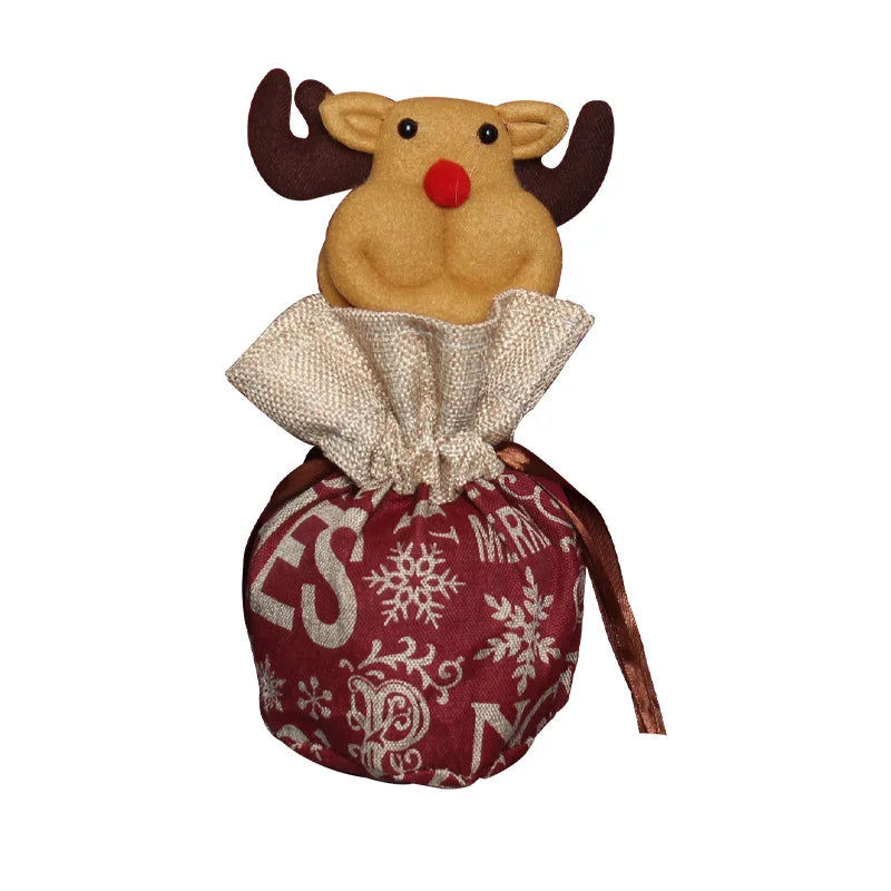 Child holding a small drawstring Christmas bag, ideal for candy or small festive gifts