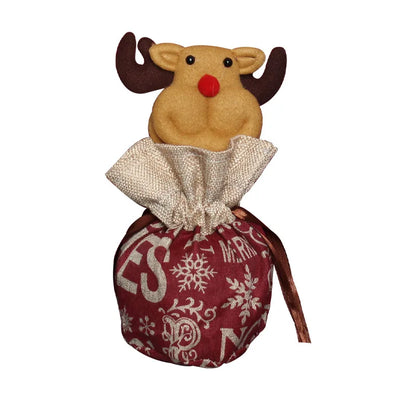 Child holding a small drawstring Christmas bag, ideal for candy or small festive gifts