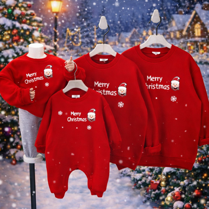 Child wearing a red Christmas romper, part of a matching family set.