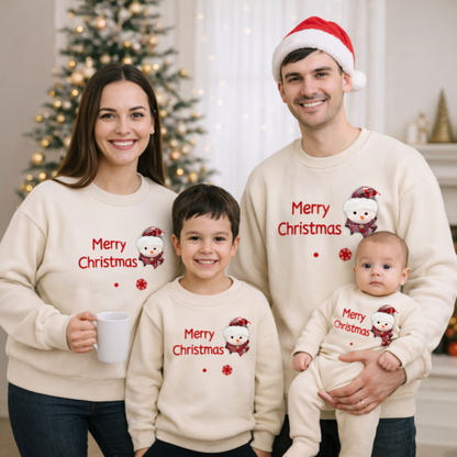 Family matching beige Christmas sweaters with snowflake pattern, perfect for holiday photos.