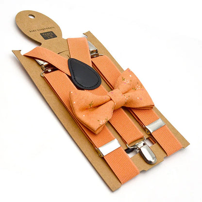 Assorted collection of colorful kids' adjustable bow tie & suspenders sets on display