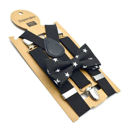 Happy child wearing a blue adjustable bow tie and suspenders set, showcasing kids' fashion