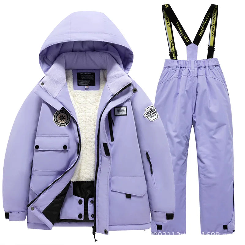 Green kids' ski suit, fleece-lined for warmth, waterproof and durable snow gear
