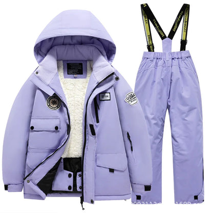 Green kids' ski suit, fleece-lined for warmth, waterproof and durable snow gear