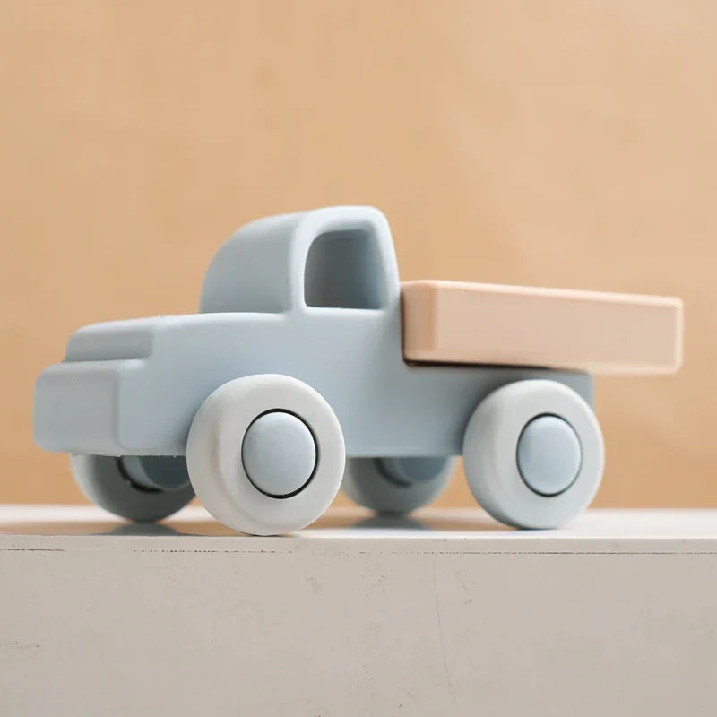 Green silicone car teether modeled as a small SUV, perfect for teething relief
