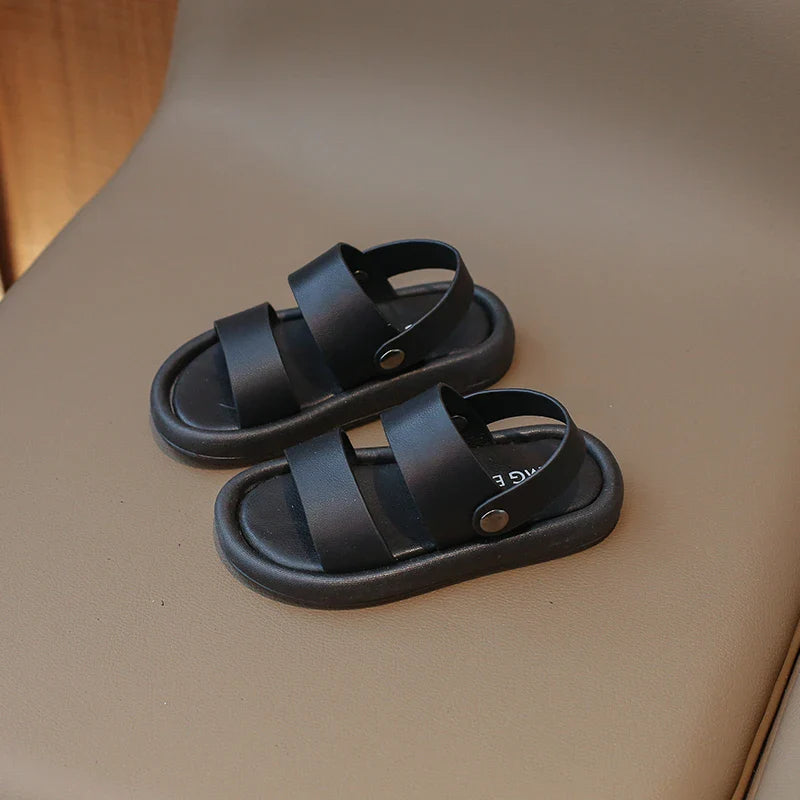 Green children's slip-on sandals with secure adjustable fasteners, ideal summer footwear for active boys & girls.