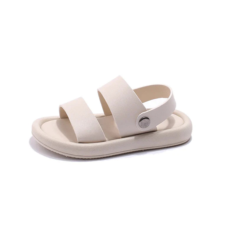 Pair of black slip-on sport sandals for active kids, boys & girls, designed for comfort & durability in outdoor activities.