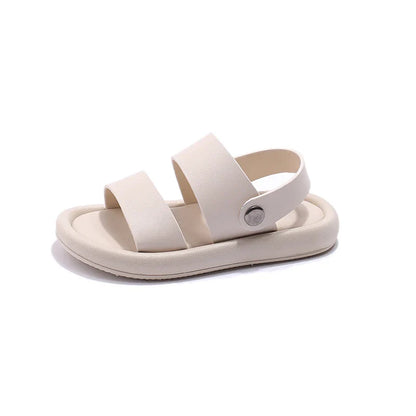 Pair of black slip-on sport sandals for active kids, boys & girls, designed for comfort & durability in outdoor activities.