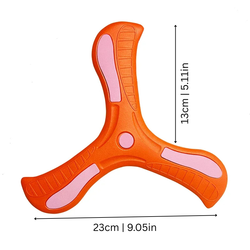 Child reaching to catch a colorful soft-grip boomerang toy in a park, promoting coordination.