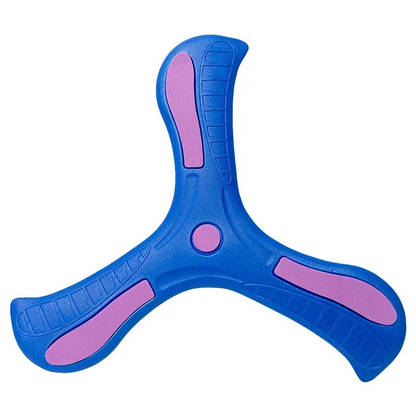 Yellow soft-grip boomerang toy resting on grass, ready for active kids' outdoor play.
