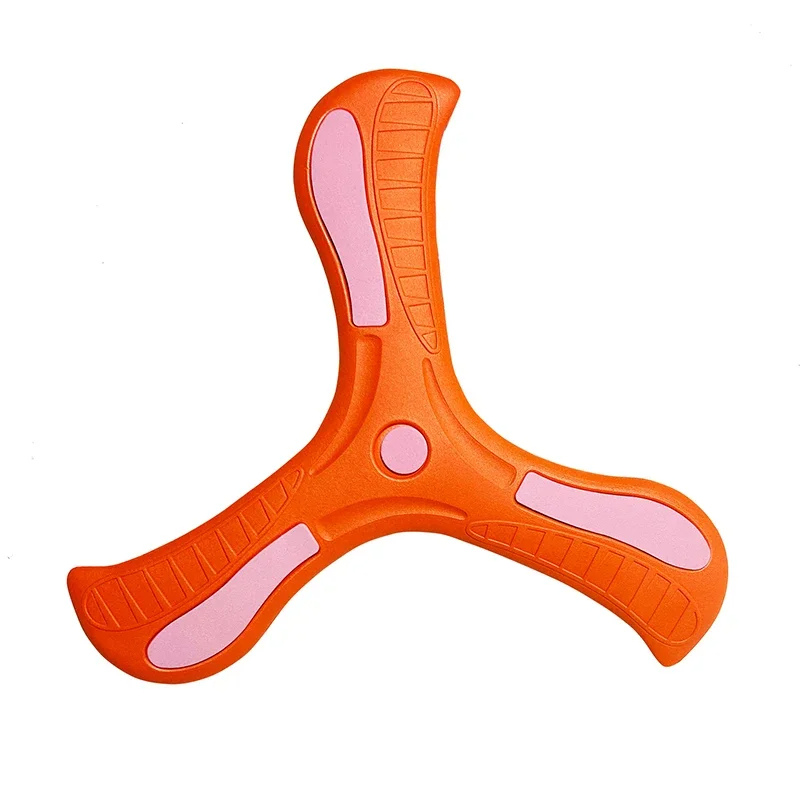 Kids laughing while throwing a soft-grip boomerang toy, emphasizing fun and active outdoor play.