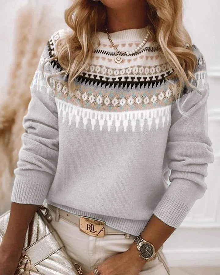 Soft, cozy knit long-sleeve women's sweater, ideal for everyday casual wear.